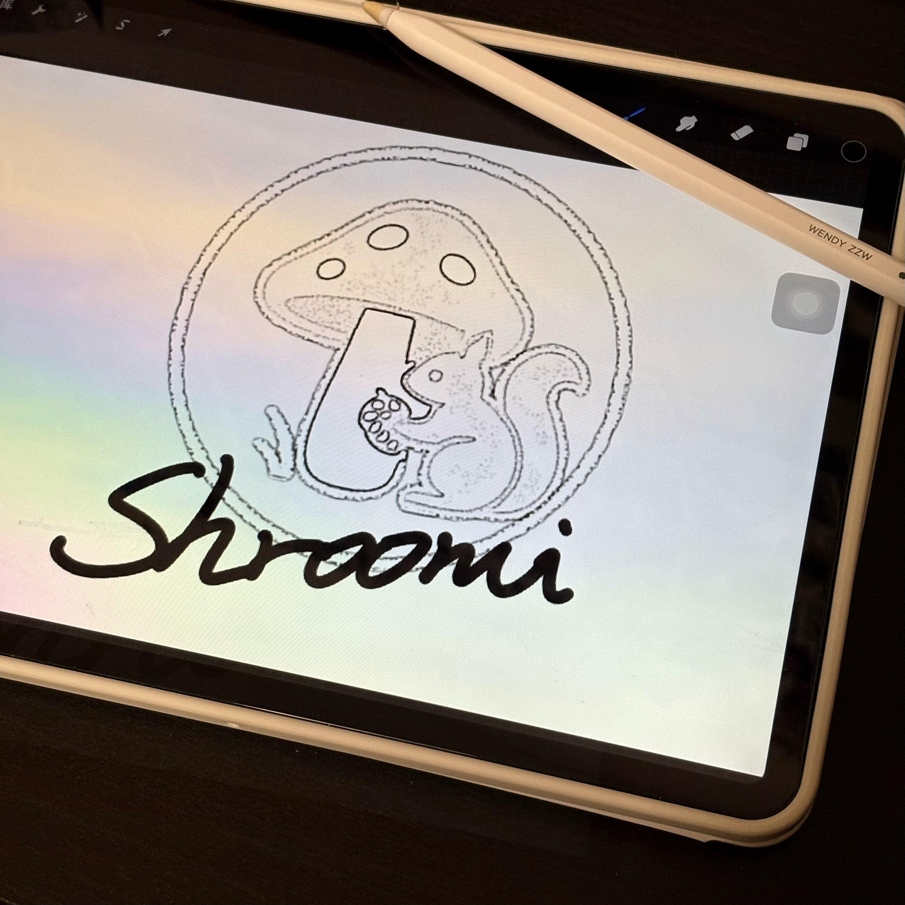 Tablet displaying a drawing of a 'Shroomi' character with a stylus on a dark surface.