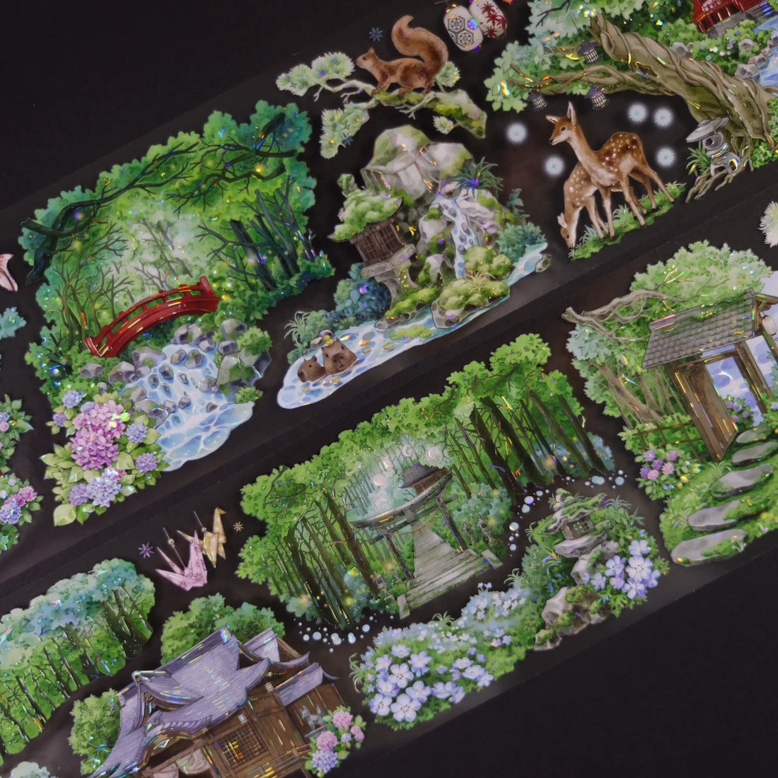 Decorative stickers with garden and nature designs on a black background, with a wooden stamp handle in the corner.