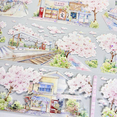 Delicate cherry blossom streets with shimmering shell-like reflections on Sakura Street Shell Shine PET Tape for crafting.