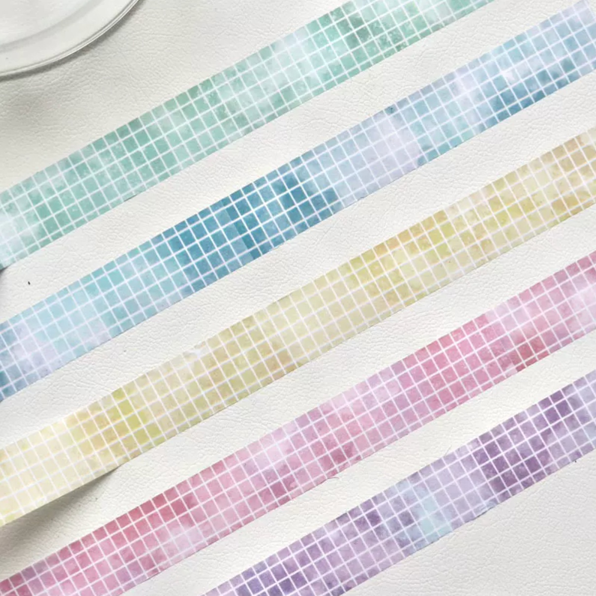 Pastel grid washi tape roll in lemon yellow with pixel grid pattern