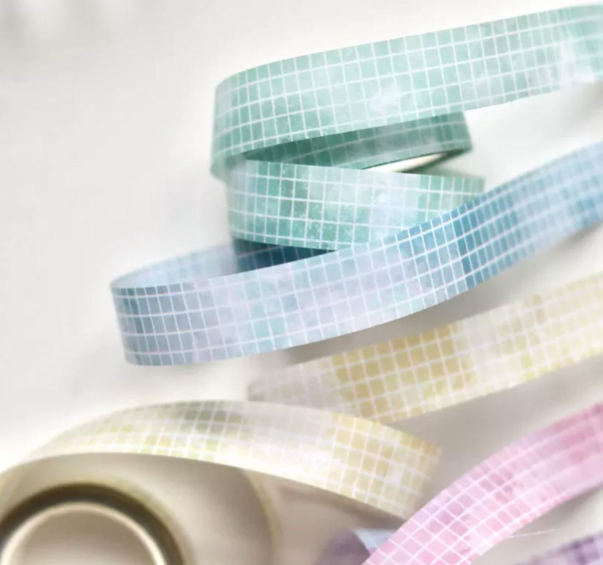 Pastel grid washi tape roll in soft mint green with clean grid pattern