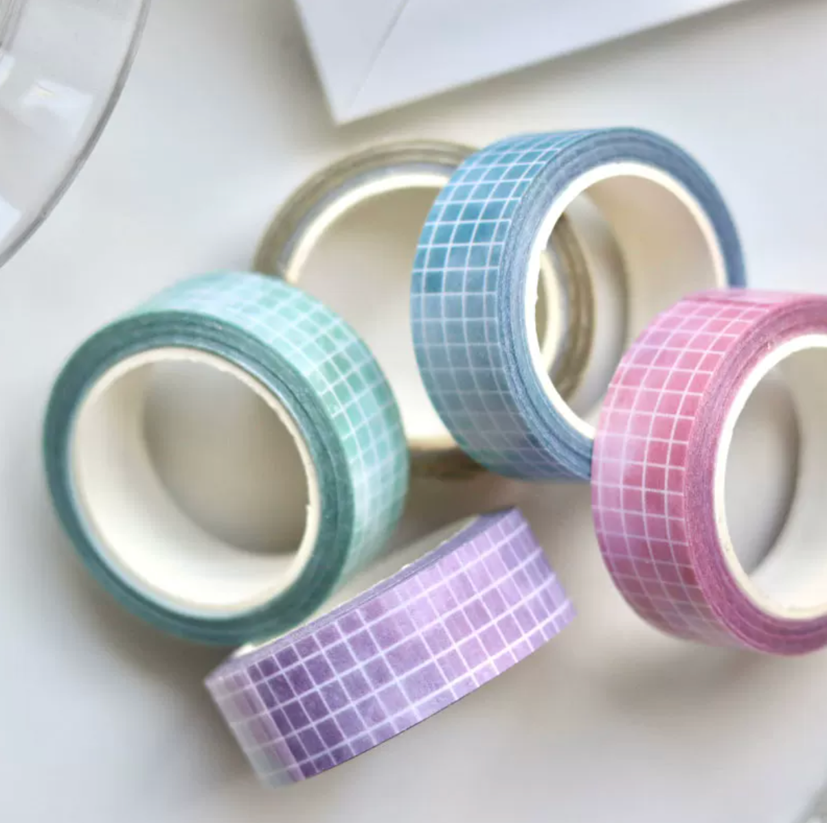 Five pastel grid washi tape rolls in mint green, lemon yellow, lilac, sky blue, and blush pink
