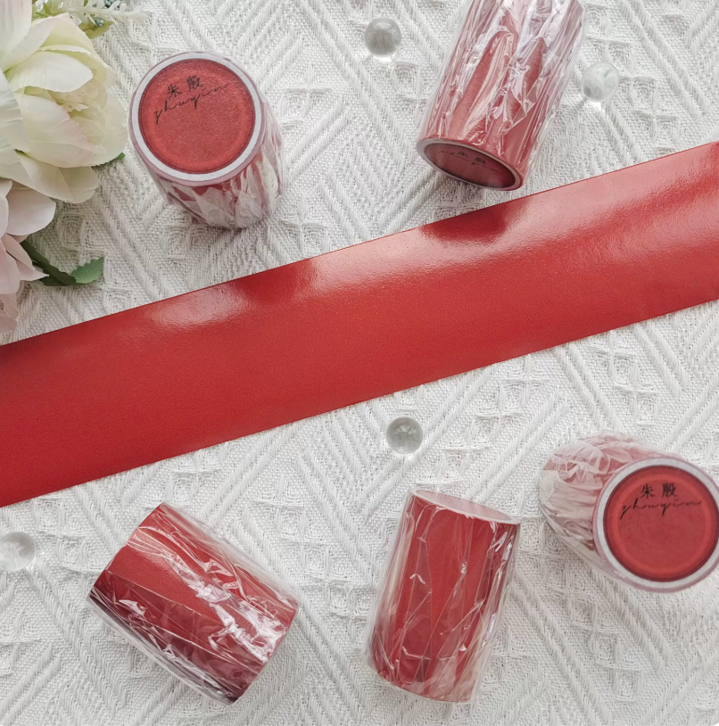 Solid color washi tape rolls in rich wine red with smooth flat finish