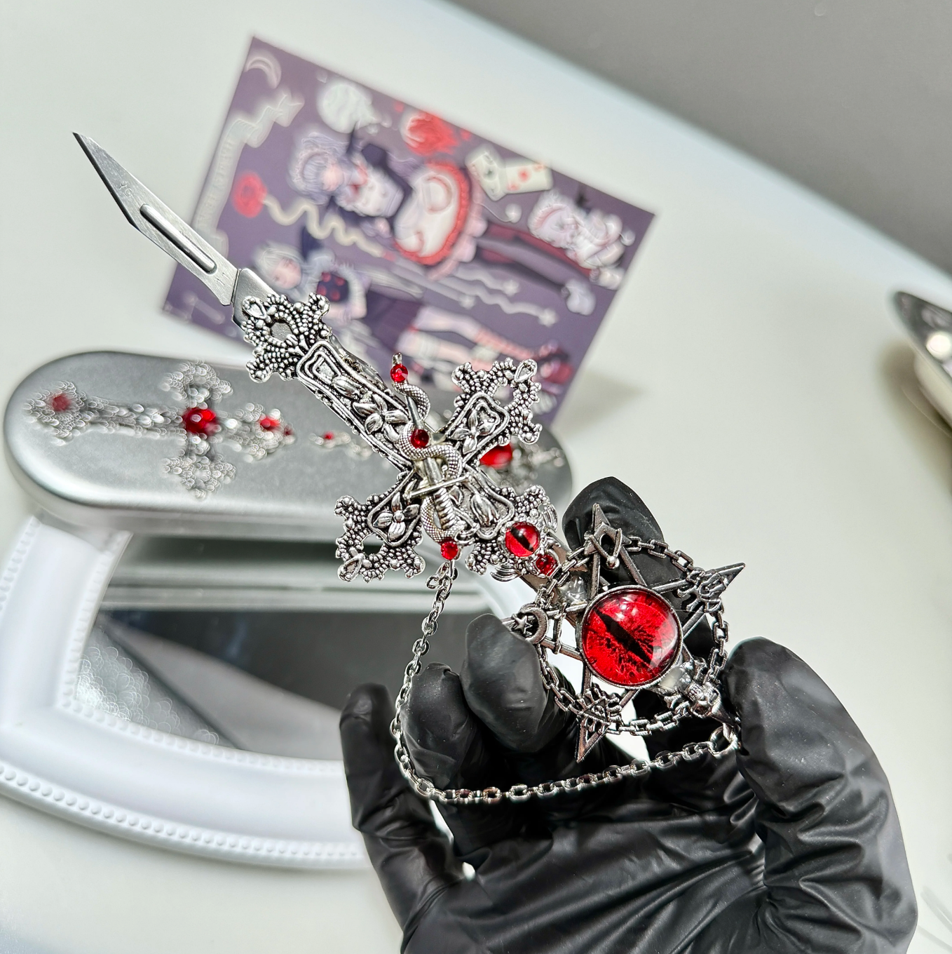 Gothic decorative craft knife with cross, bat, chain, rose, and gemstone charms