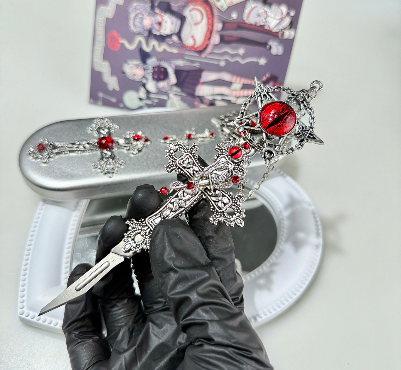 Gothic decorative craft knife with cross, bat, chain, rose, and gemstone charms