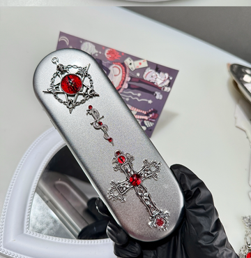 Silver metal tool storage tin with gothic red gemstone charm decorations