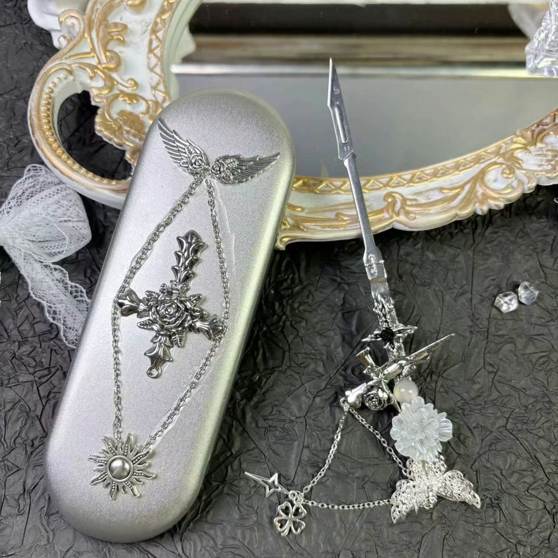 Silver metal tool storage tin with gothic red gemstone charm decorations