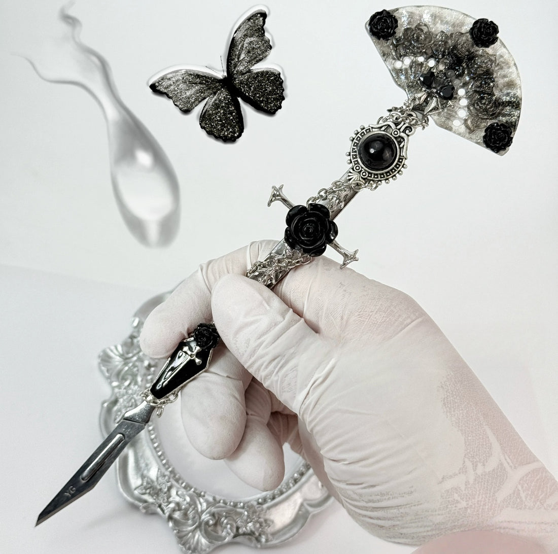 Gothic decorative craft knife with cross, bat, chain, rose, and gemstone charms