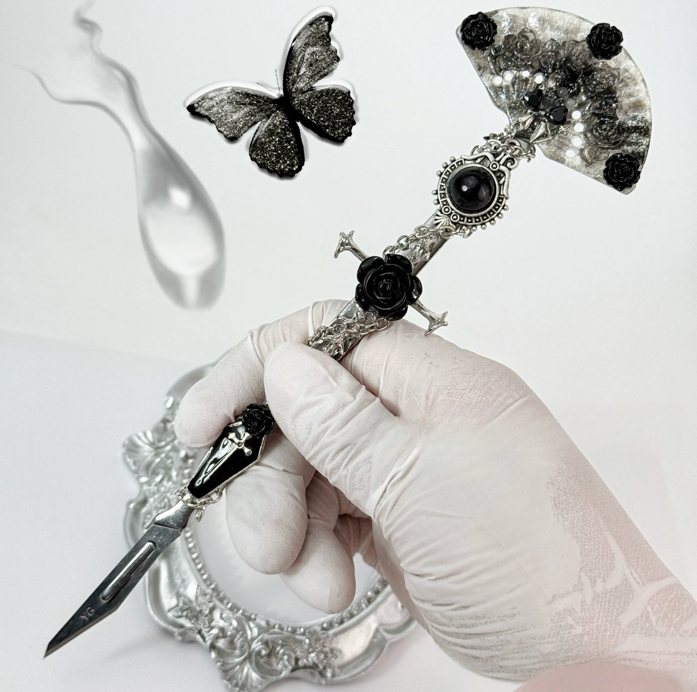 Gothic decorative craft knife with cross, bat, chain, rose, and gemstone charms