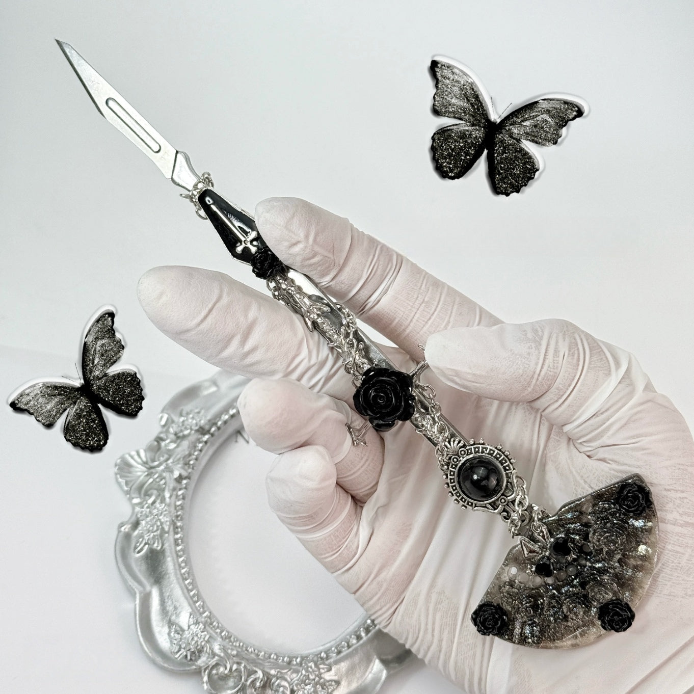 Gothic decorative craft knife with cross, bat, chain, rose, and gemstone charms