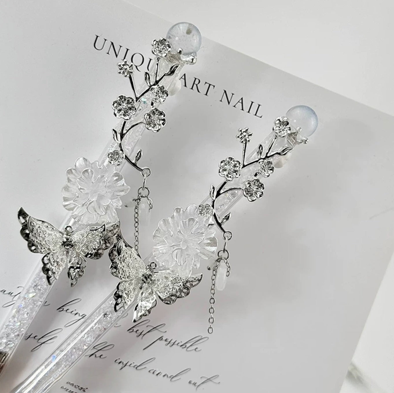 Celestial butterfly decorative craft knife with moon, sun, rose, and chain charms