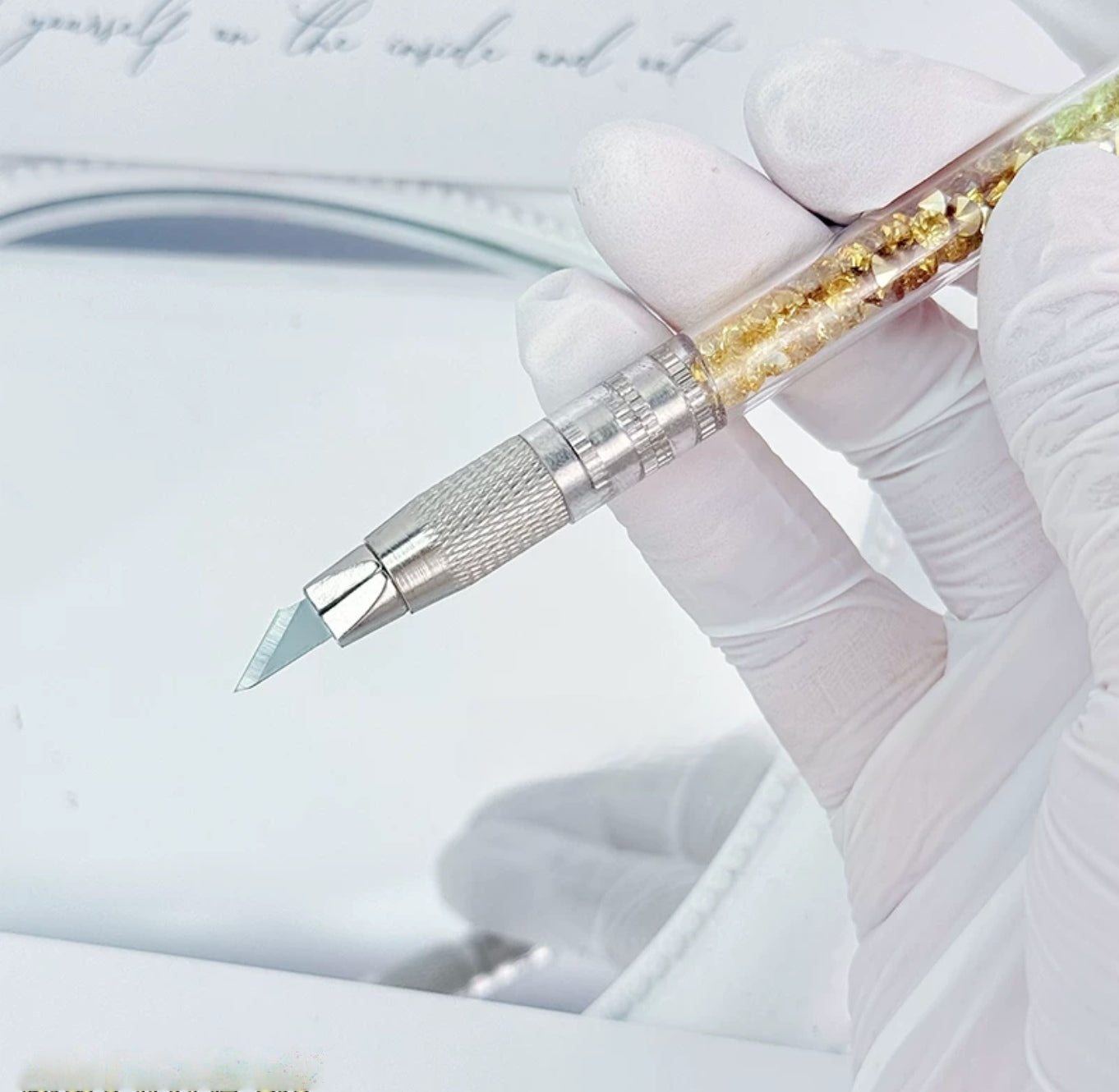 Gold butterfly decorative craft knife with floral charms and pearl accents