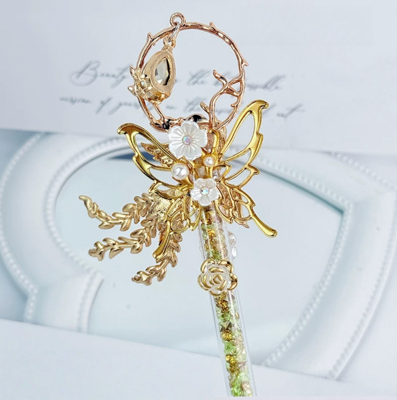 Gold butterfly decorative craft knife with floral charms and pearl accents