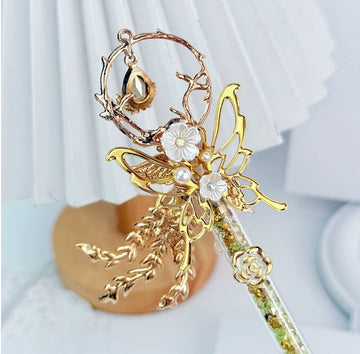 Gold butterfly decorative craft knife with floral charms and pearl accents