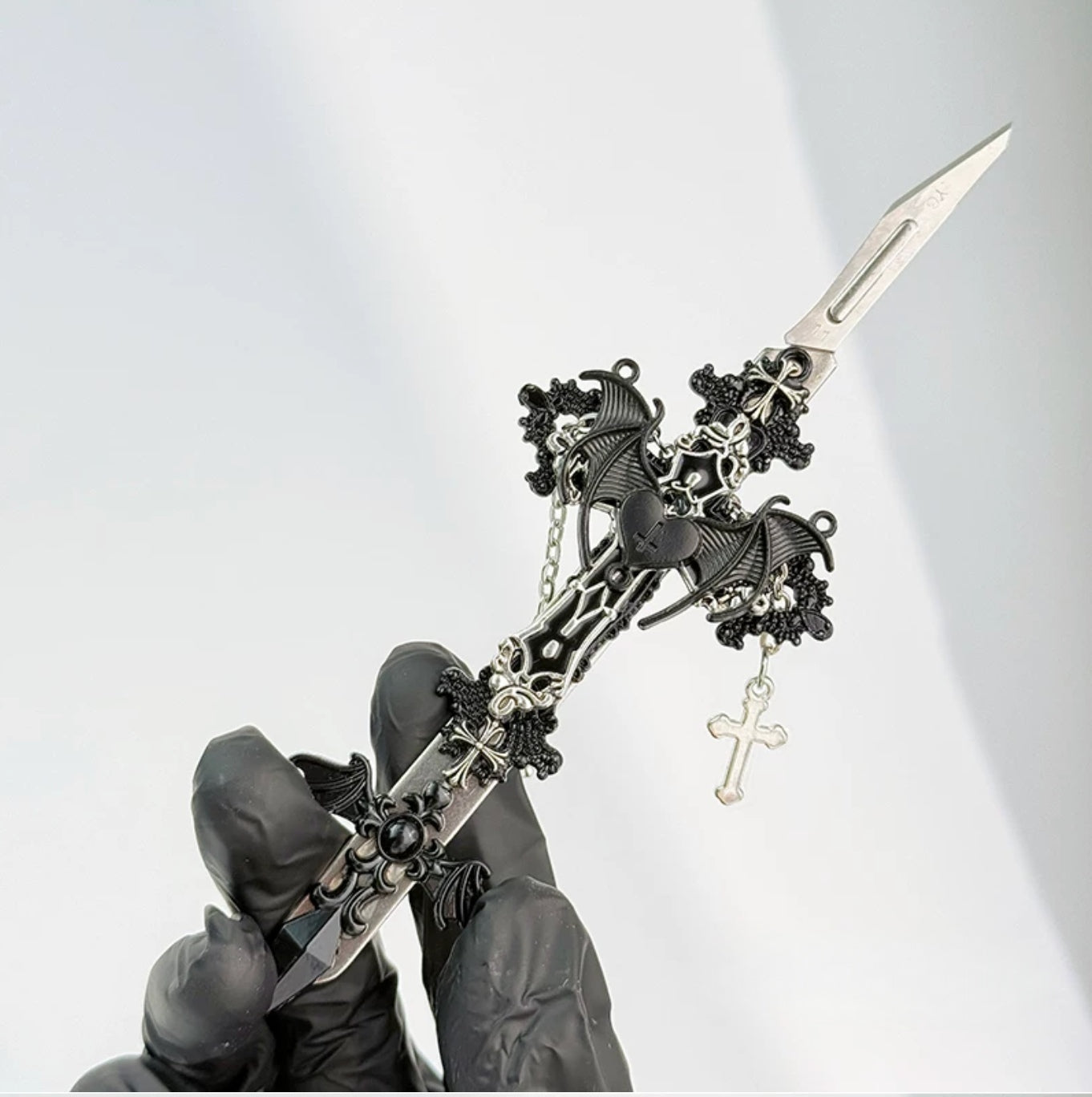 Gothic decorative craft knife with cross, bat, chain, rose, and gemstone charms