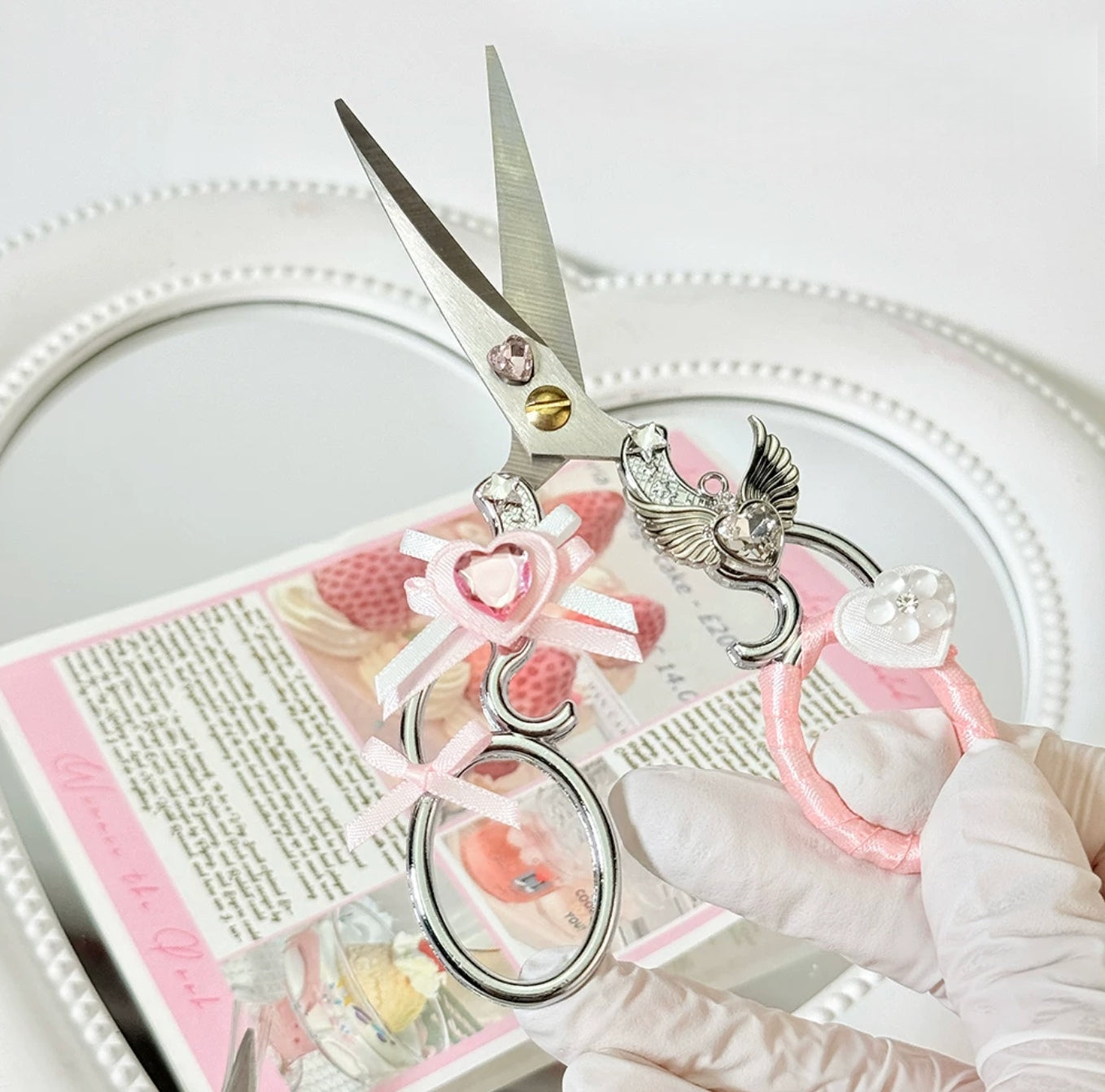 Decorative metal craft scissors with ribbon, wing, heart, and cross charms
