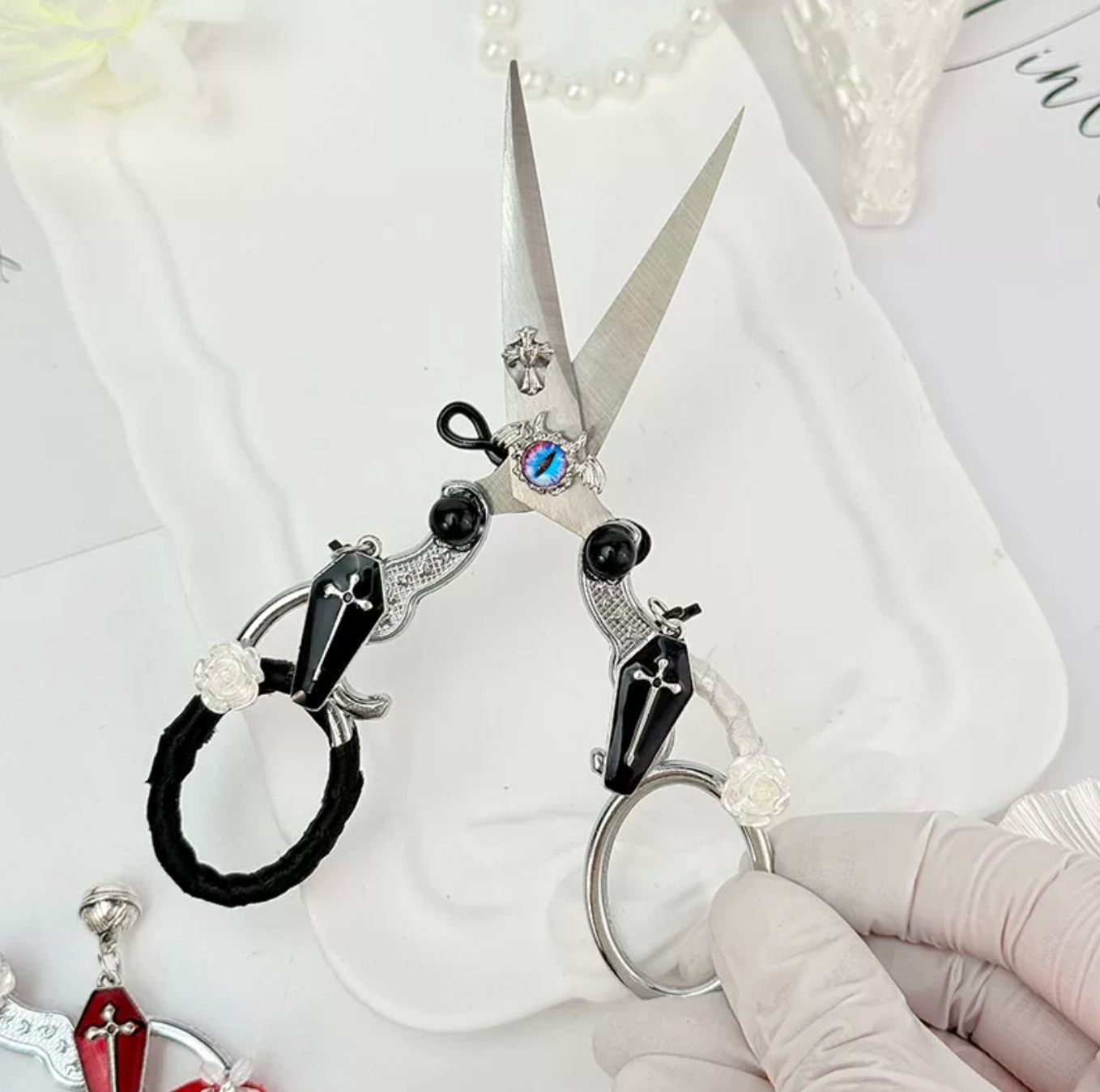 Decorative metal craft scissors with ribbon, wing, heart, and cross charms