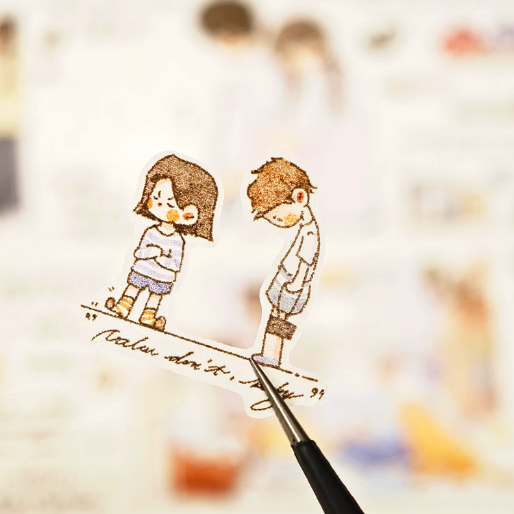 Shared Moments character tape close-up with two small figures and handwritten text accents