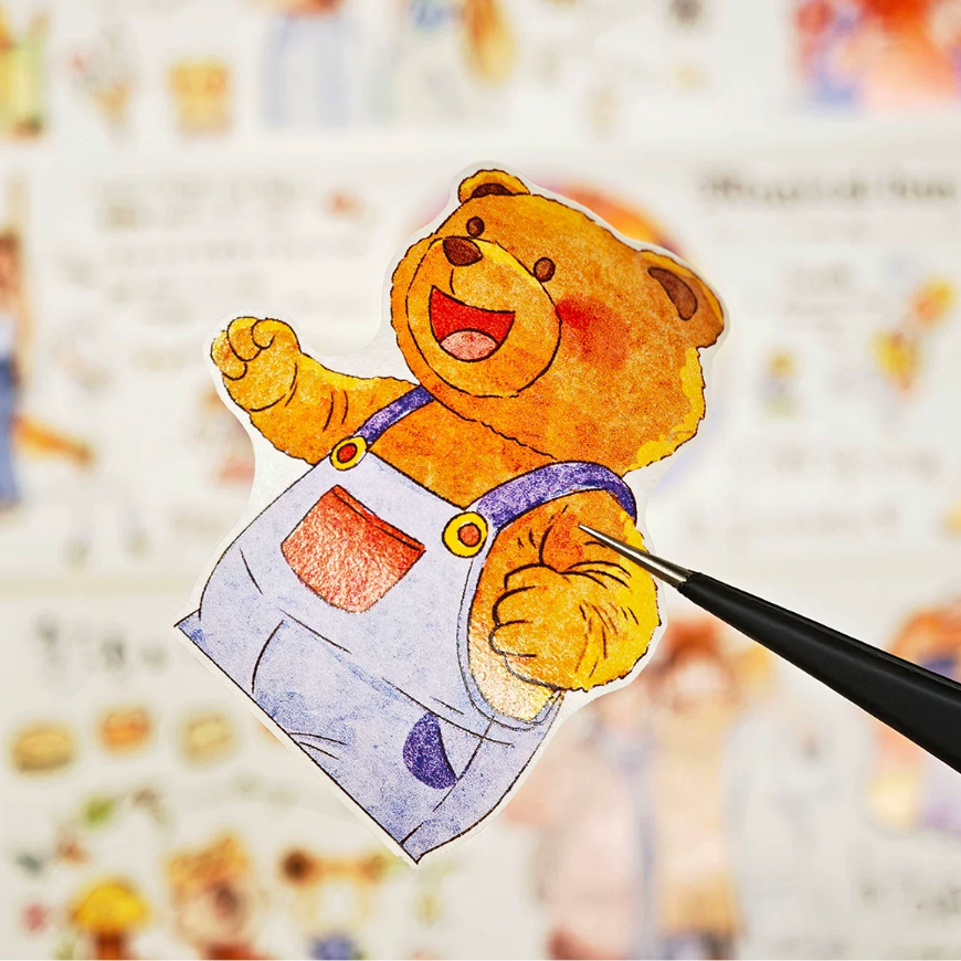 Amusement park teddy mascot die-cut piece being lifted from decorative tape