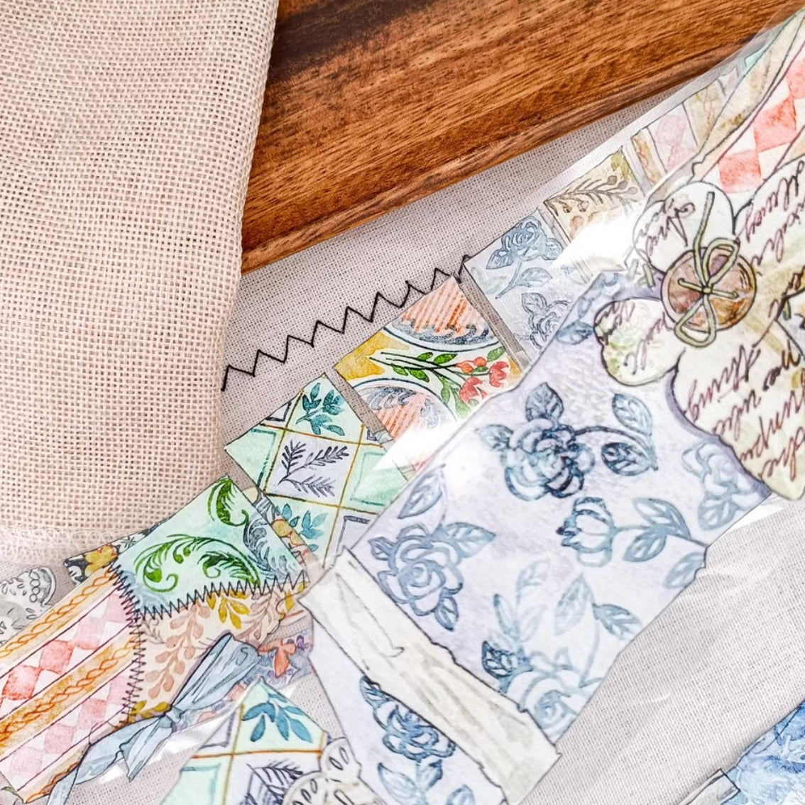 Patchwork countryside scenes, flowers, and vintage labels on PET tape