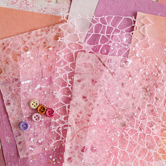 Mixed-texture pastel scrapbooking paper with romantic lace mesh overlay pattern