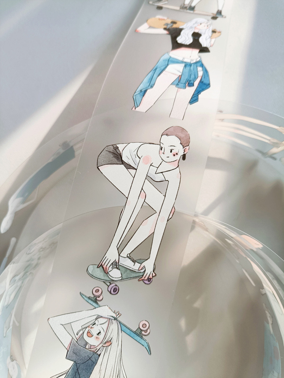 Illustrated girl sitting with a skateboard