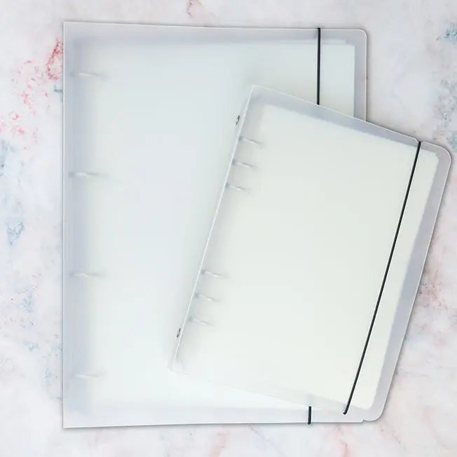 Colorful washi tape storage album with clear pocket pages for organizing pre-cut tape pieces and stickers neatly.