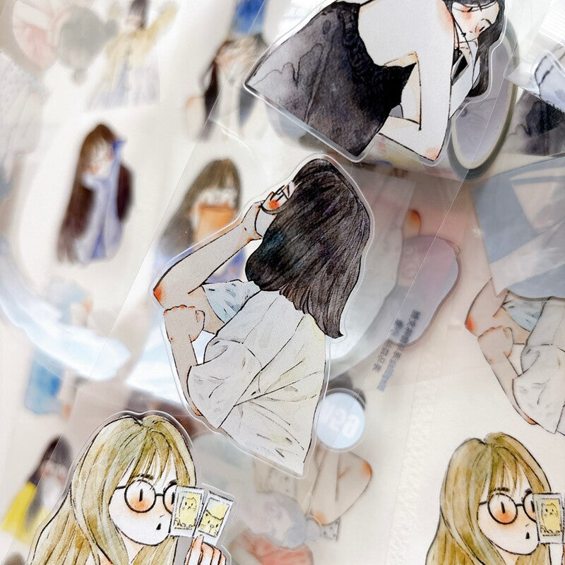 Die-cut watercolor girl portraits tape pieces layered on white paper