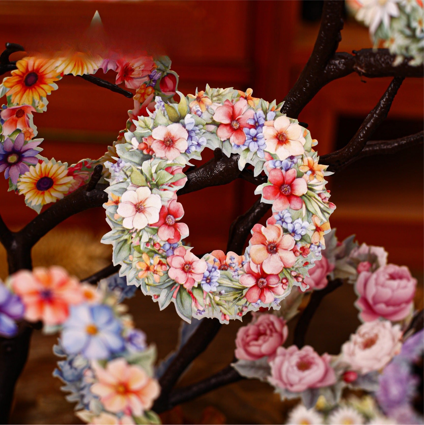 Vintage floral wreath stickers on branches with pink flowers and soft botanical details