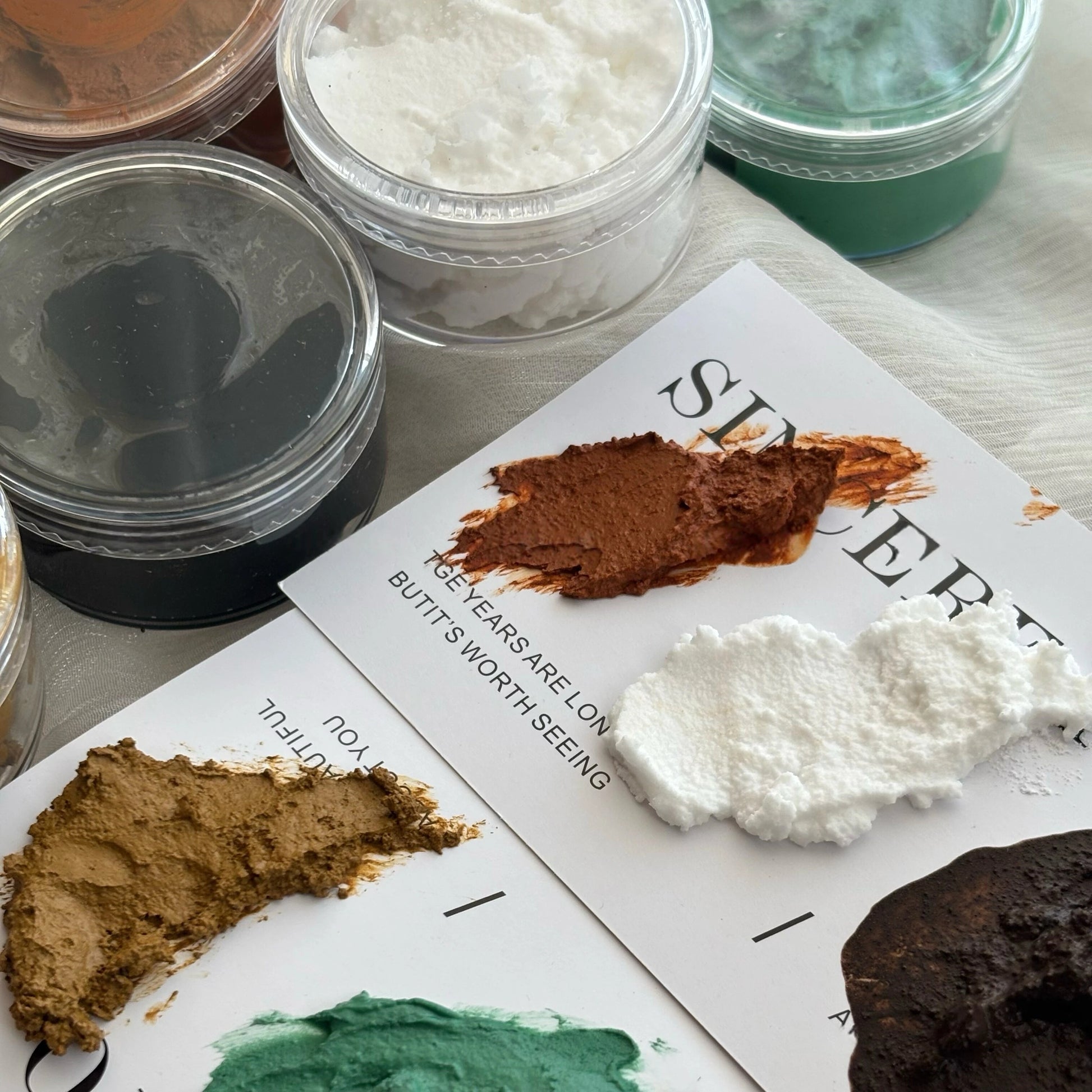 Sandstone texture paste jars with gritty raised craft medium for junk journal backgrounds and mixed-media collage
