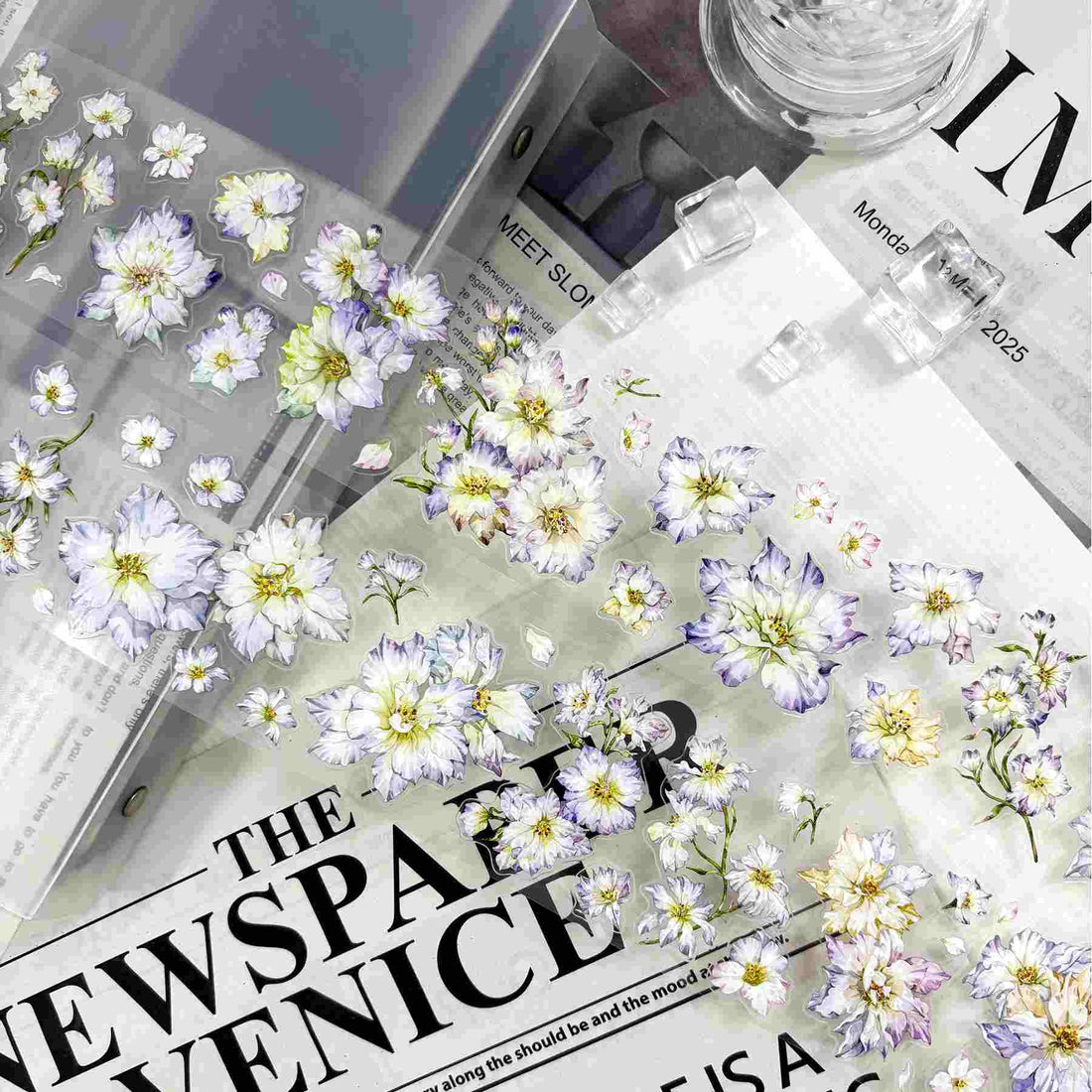 Delicate white and lavender watercolor floral die-cut stickers in a fluttering pattern