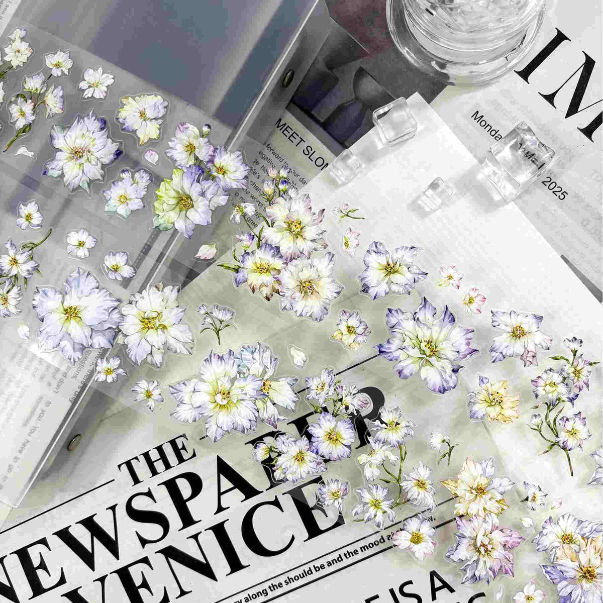Delicate white and lavender watercolor floral die-cut stickers in a fluttering pattern