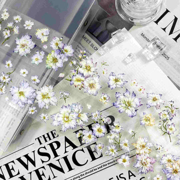 Delicate white and lavender watercolor floral die-cut stickers in a fluttering pattern