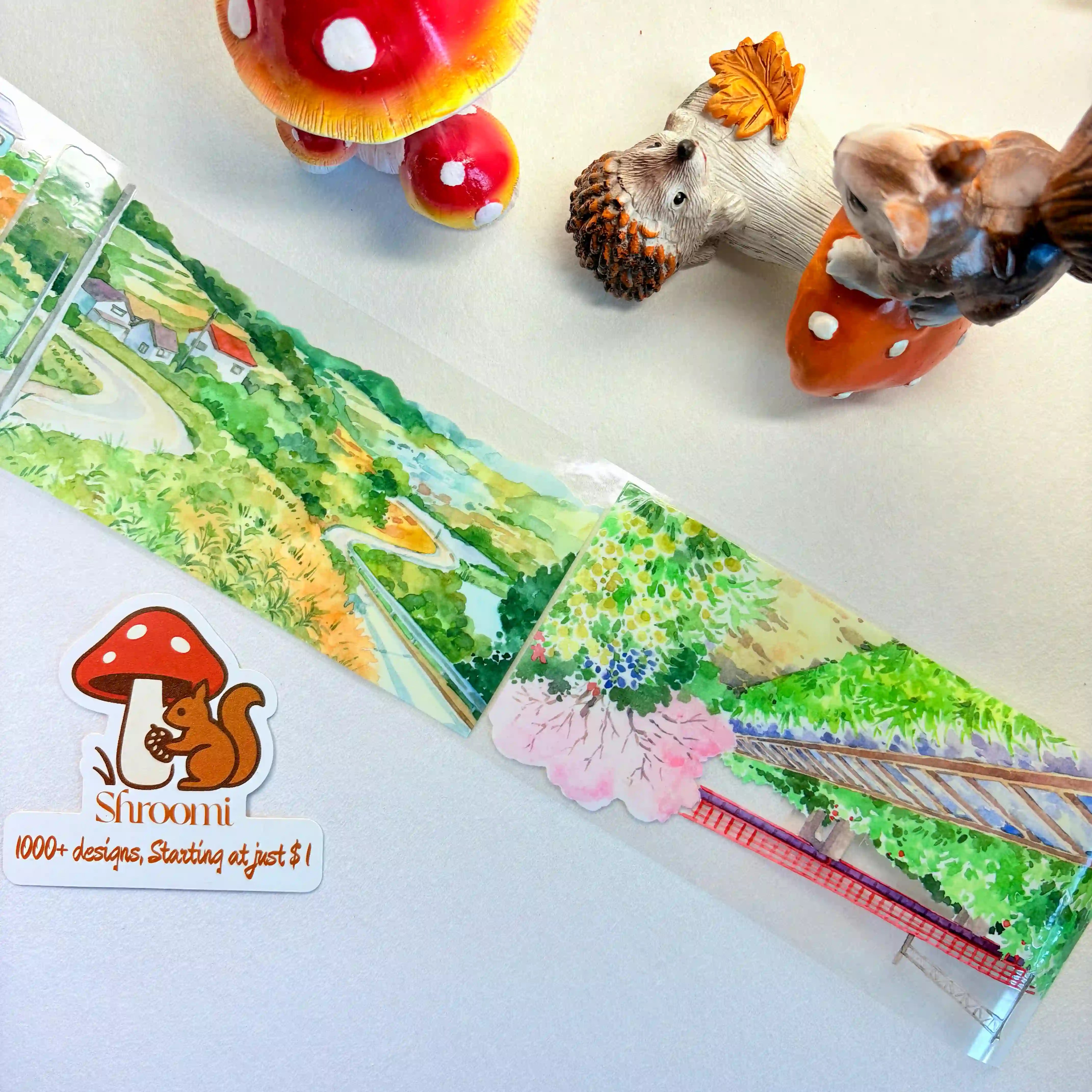 Charming Countryside PET Scene Making Tape featuring a watercolor landscape with cherry blossoms, cottages, and winding roads.