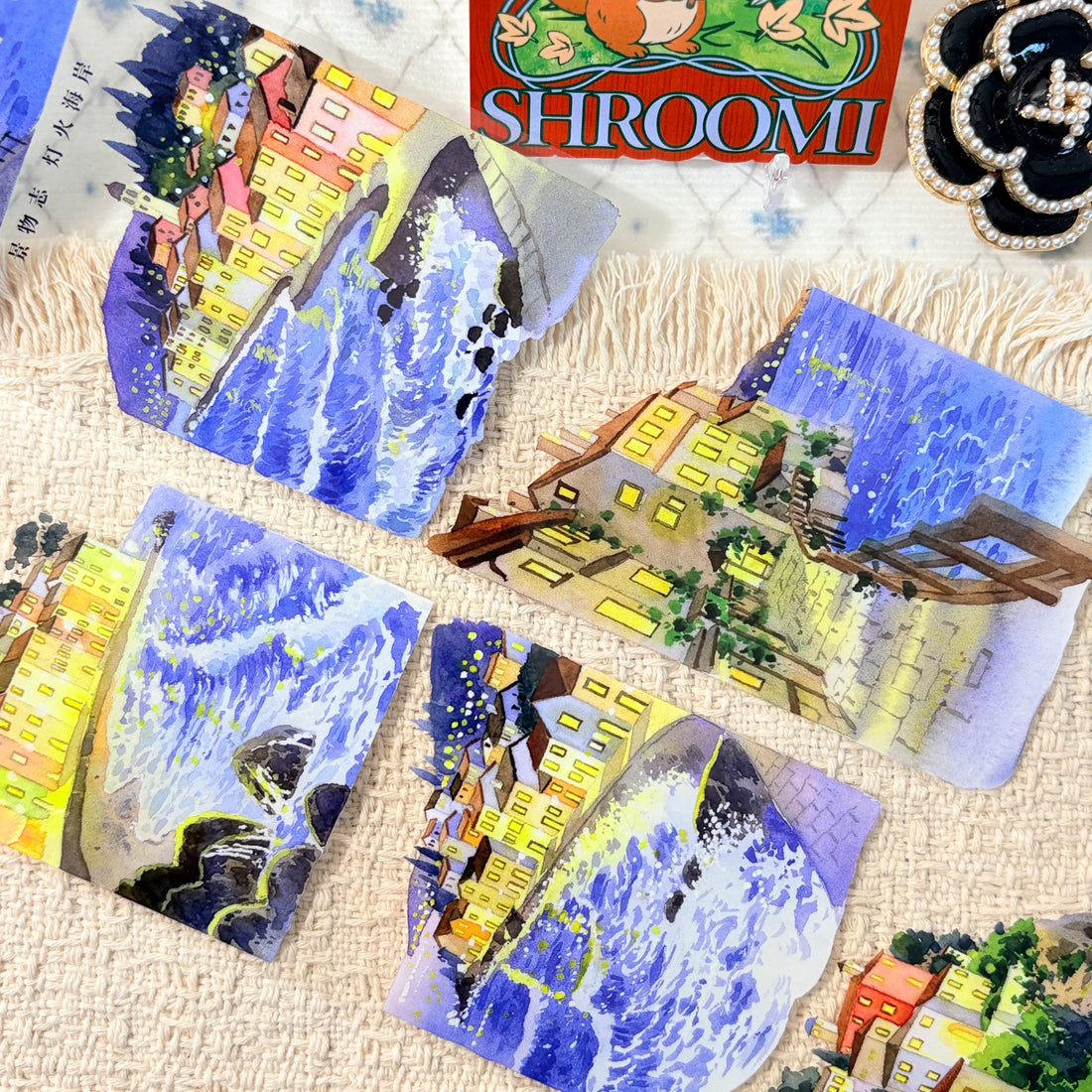 Glowing waterfront buildings in deep blue evening scenes on decorative tape