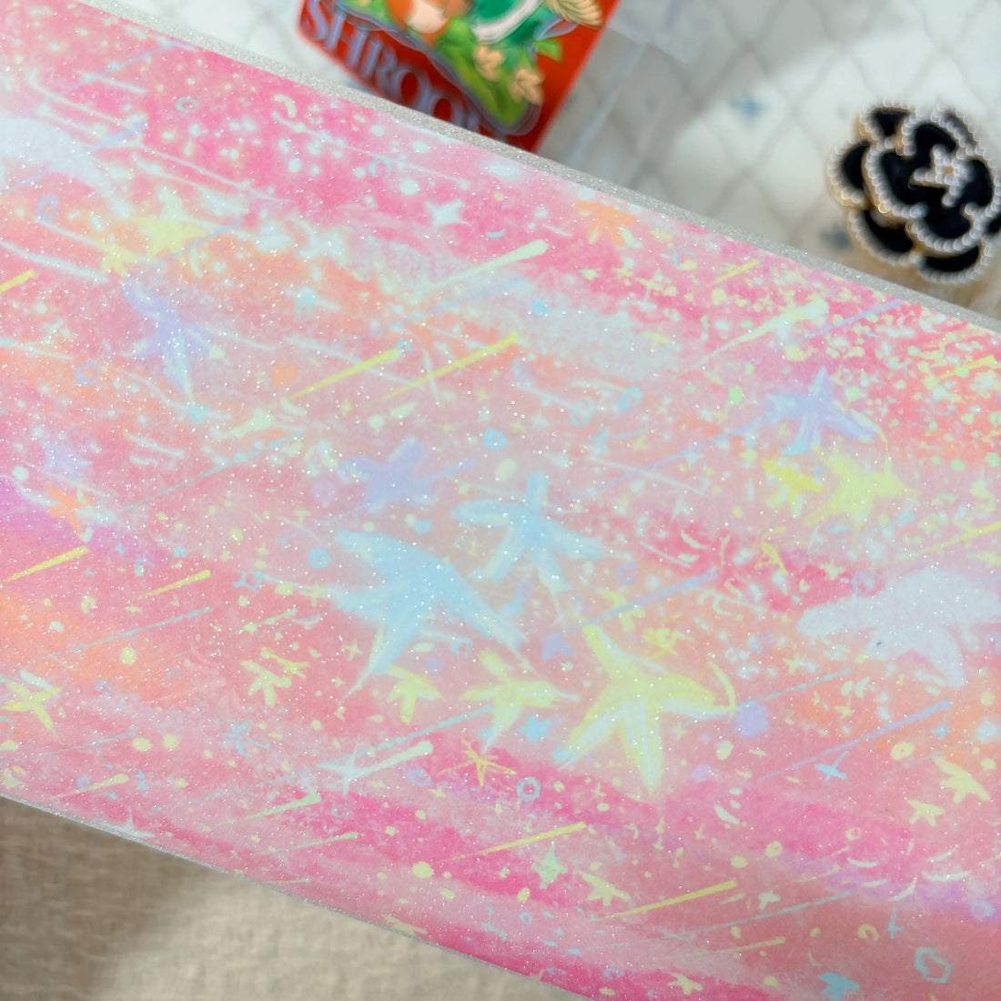 Colorful fireworks and glowing stars across a deep night sky on decorative tape