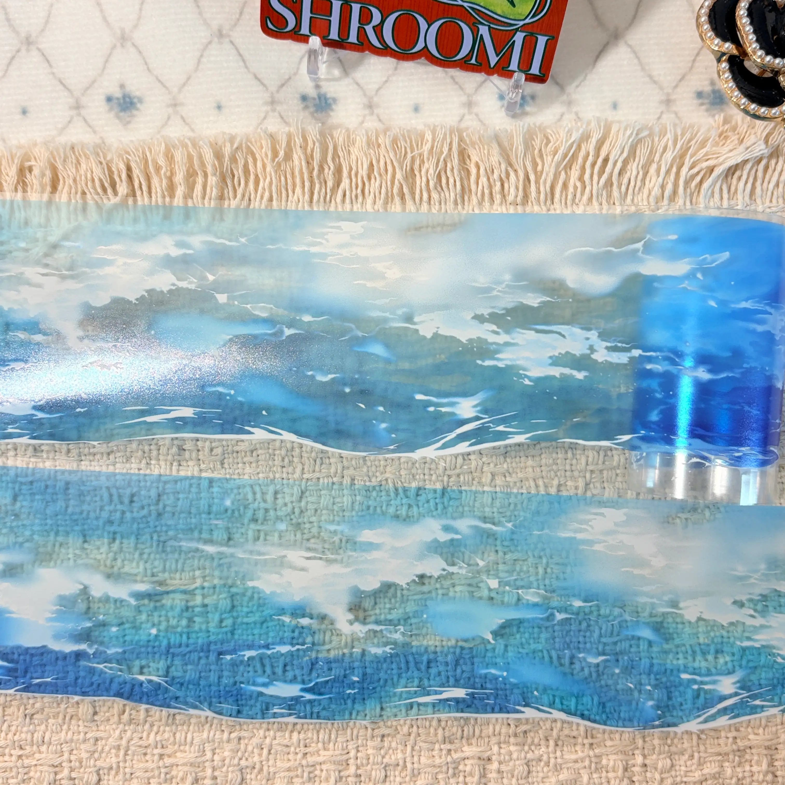 Bright blue ocean waves and airy summer light on decorative tape