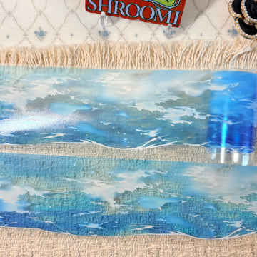 Bright blue ocean waves and airy summer light on decorative tape