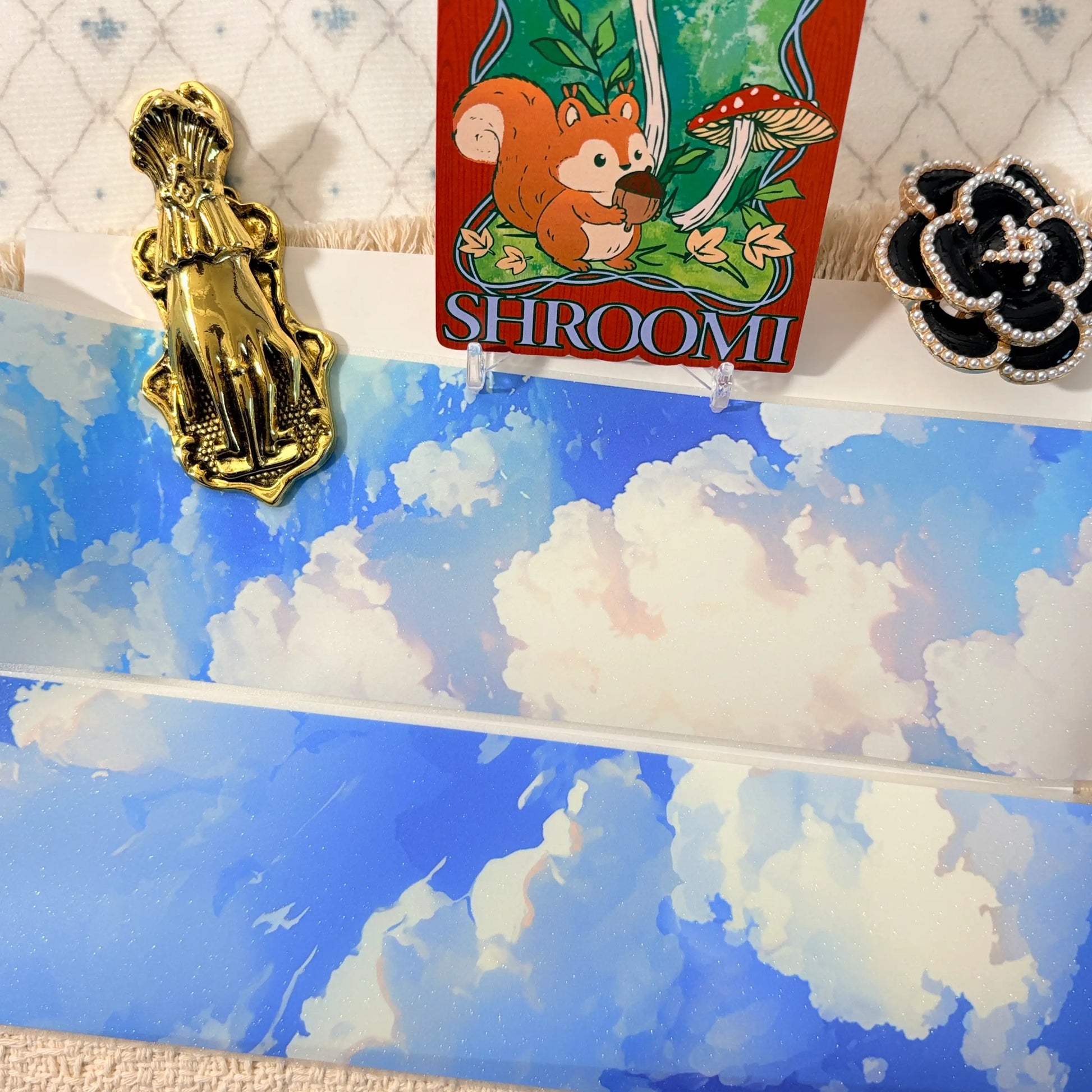 Soft blue clouds, a subtle rainbow, and starry shimmer on decorative tape