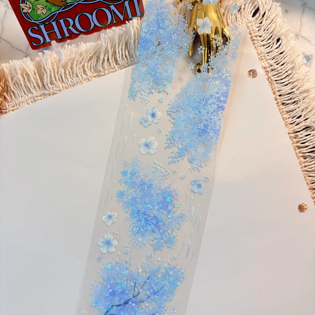 Blue floral border with blossoms, butterflies, and rain-like accents on transparent PET tape