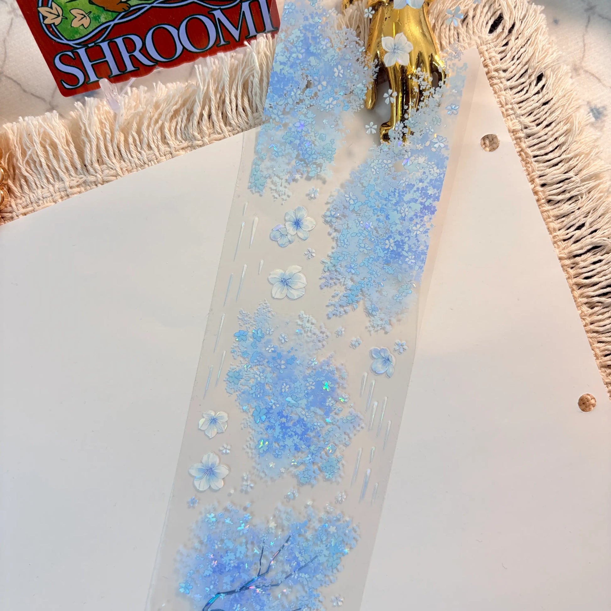 Blue floral border with blossoms, butterflies, and rain-like accents on transparent PET tape