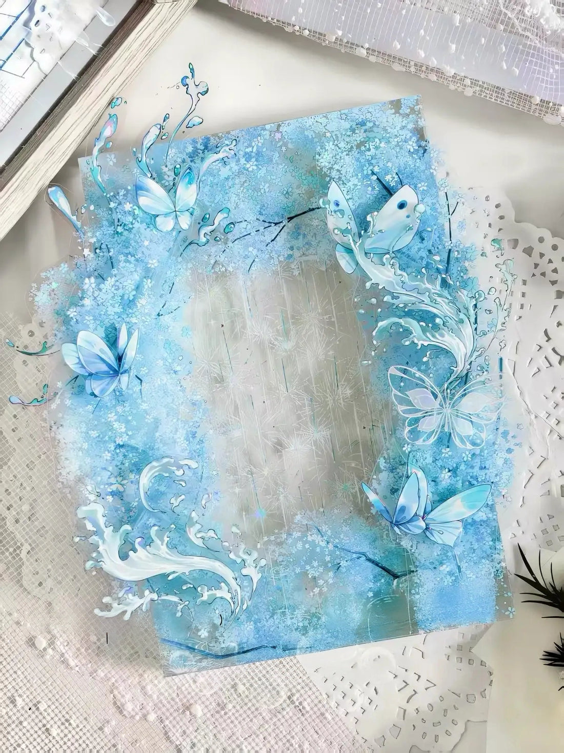 Blue floral border with blossoms, butterflies, and rain-like accents on transparent PET tape
