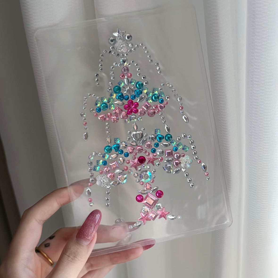 Clear photo card decorated with pink and blue rhinestone stickers