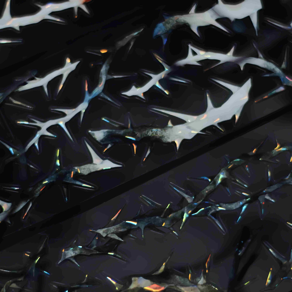 White thorn tape with iridescent sparkle on a dark background