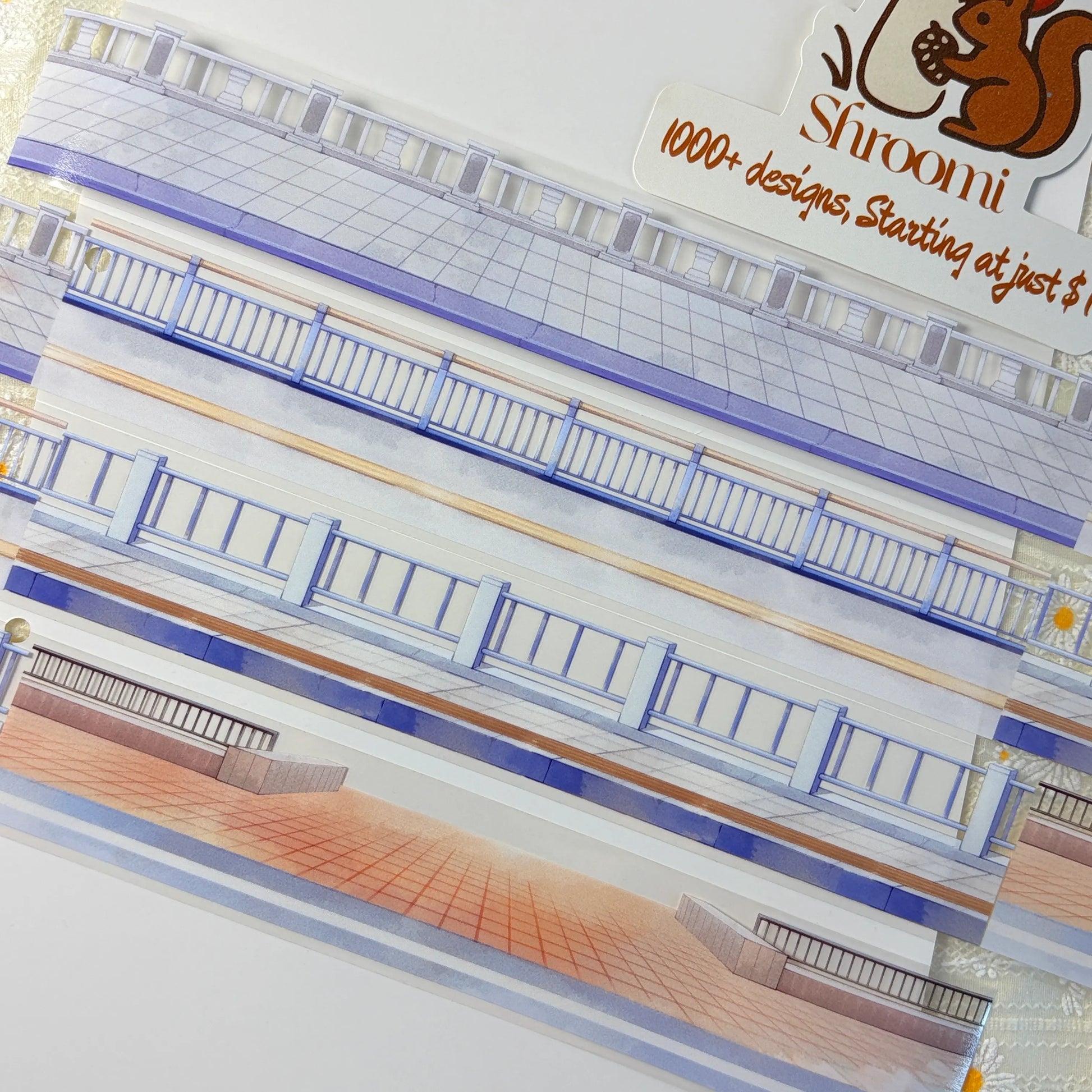 Urban street scene PET tape showing multi-story building facades with blue railings and warm terracotta pavement