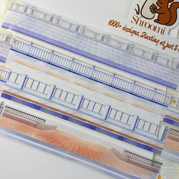 Urban street scene PET tape showing multi-story building facades with blue railings and warm terracotta pavement