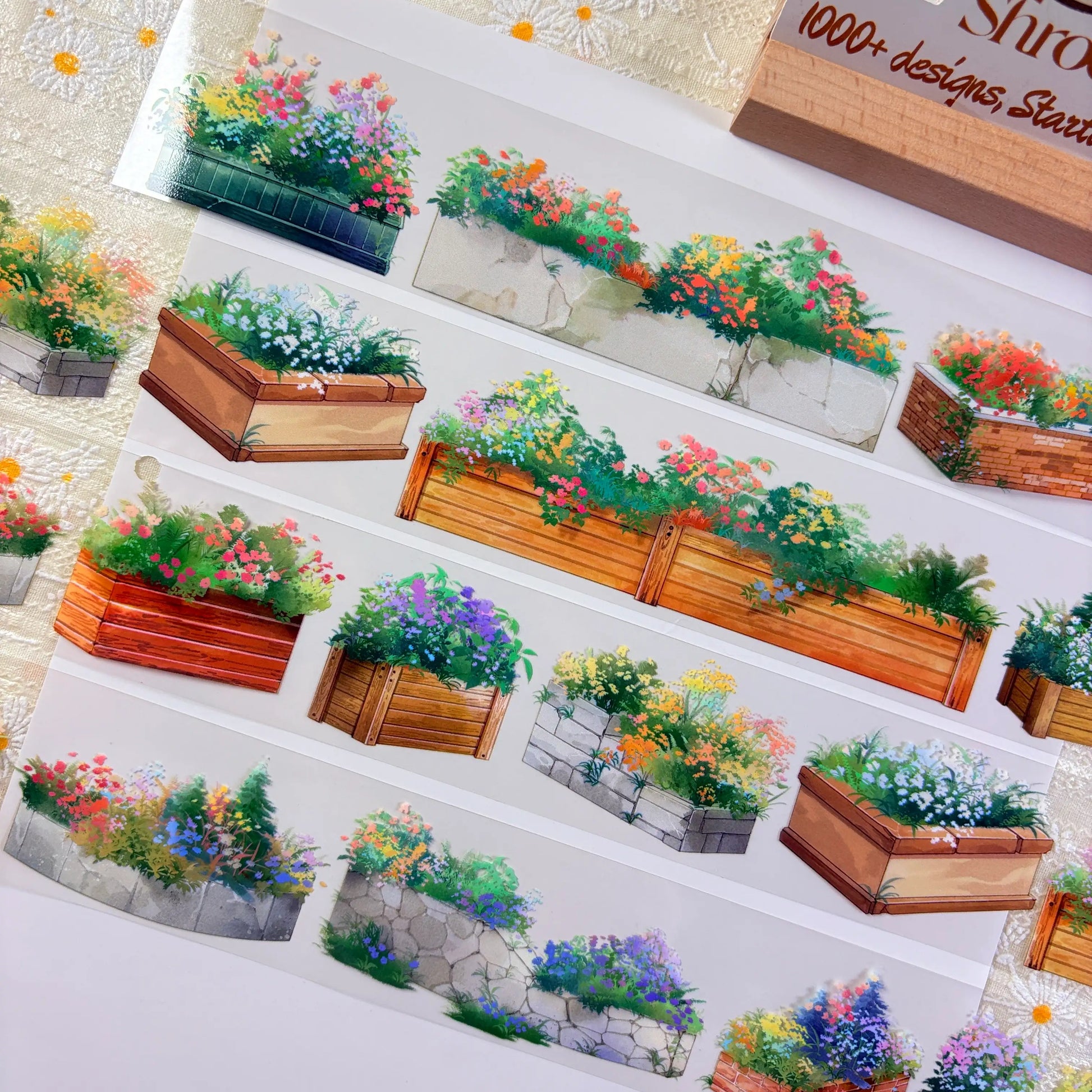 Flower planter box PET tape close-up showing multiple planter styles with red orange purple and white blooms