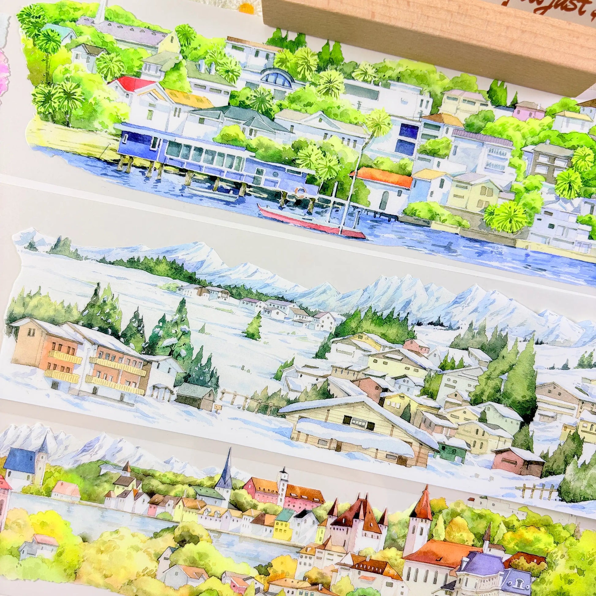 Four seasons panoramic PET tape showing lush green summer countryside village with rolling hills