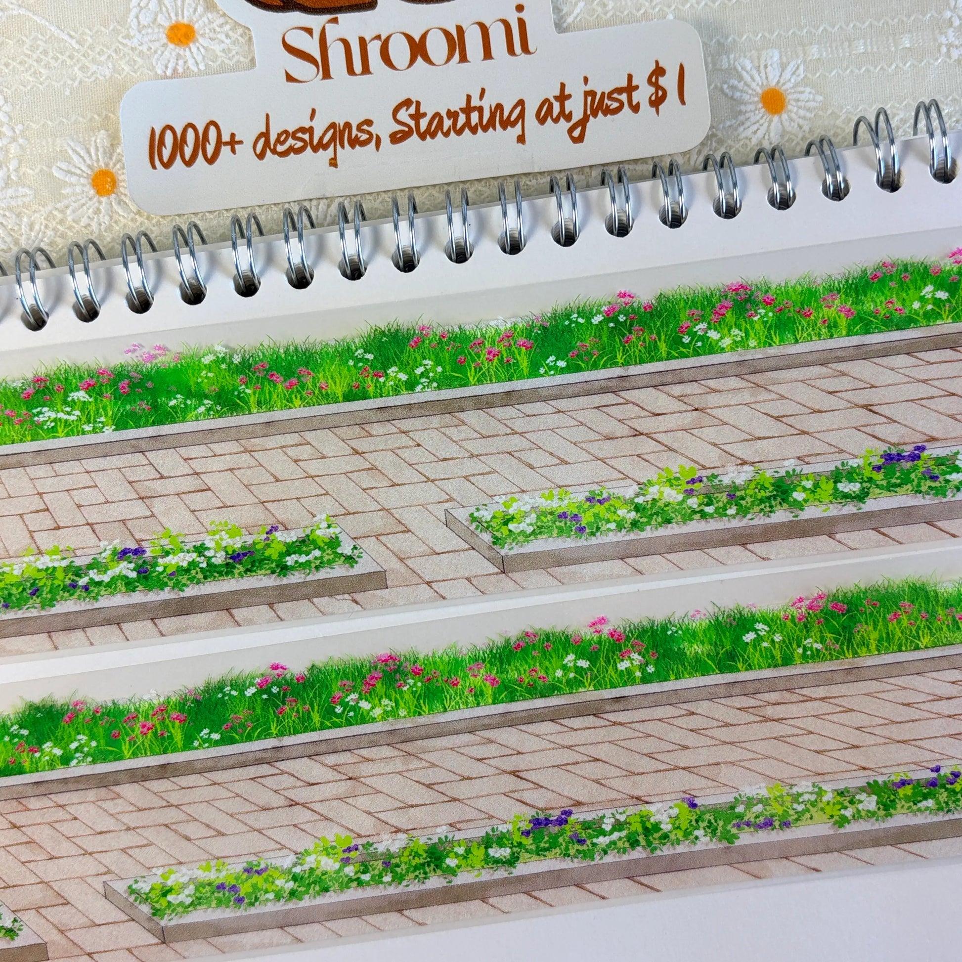 Wildflowers and green grass growing alongside stone brick sidewalk pavement on PET tape