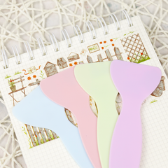 Handy plastic spatula designed for flattening stickers, ensuring a smooth, edge-free application on any surface.